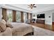 Main bedroom with hardwood floors, large windows, and sitting area at 3830 Teesdale Ct, Sandy Springs, GA 30350