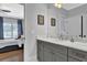 Bathroom with gray vanity, marble countertop, and access to bedroom at 3830 Teesdale Ct, Sandy Springs, GA 30350