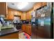 Updated kitchen features wood cabinets, stainless steel appliances, and granite countertops at 705 Inglewood Se Dr, Smyrna, GA 30080