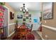 Small dining area with a round table, colorful decor, and access to the backyard at 705 Inglewood Se Dr, Smyrna, GA 30080