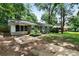 Brick ranch home with gray shutters, landscaped yard, and a spacious front yard at 705 Inglewood Se Dr, Smyrna, GA 30080