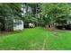 Large backyard with shed, gazebo, and plenty of green space at 705 Inglewood Se Dr, Smyrna, GA 30080