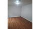 Spacious bedroom with wood flooring and neutral walls at 1847 Whitehall Forest Se Ct, Atlanta, GA 30316