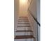 Interior staircase with wood steps and metal railing at 1847 Whitehall Forest Se Ct, Atlanta, GA 30316