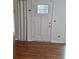 Front entry with wood flooring and white door at 1847 Whitehall Forest Se Ct, Atlanta, GA 30316
