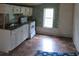 Small kitchen with white cabinets and a tile backsplash at 126 Irvin St, Jonesboro, GA 30236