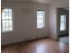 Simple living room with wood floors and multiple windows at 126 Irvin St, Jonesboro, GA 30236
