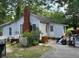 Older home needing repairs, cluttered yard at 126 Irvin St, Jonesboro, GA 30236
