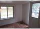 Simple entryway with wood floors, a window, and a door with a glass insert at 126 Irvin St, Jonesboro, GA 30236