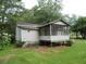 One-story house with screened porch and large backyard at 126 Irvin St, Jonesboro, GA 30236