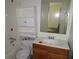 Small bathroom with a toilet, sink, and vanity needing updates at 126 Irvin St, Jonesboro, GA 30236