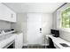 Laundry room with washer, dryer, and workspace at 976 Washington St, Atlanta, GA 30315