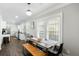 Modern dining area with wood table, bench seating, and hardwood floors at 976 Washington St, Atlanta, GA 30315