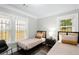 Charming bedroom with two twin beds, nightstands, and ample natural light at 976 Washington St, Atlanta, GA 30315