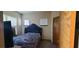 Primary bedroom with plush carpet and large window at 898 Oak St # 1127, Atlanta, GA 30310