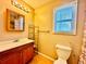 Bathroom with vanity, toilet, and shower/tub combo at 504 N Little Victoria Rd, Woodstock, GA 30189