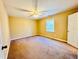 Spacious bedroom with neutral walls and carpet flooring at 504 N Little Victoria Rd, Woodstock, GA 30189