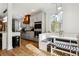 Modern kitchen with stainless steel appliances and built-in breakfast nook at 1587 Alder Se Ct, Atlanta, GA 30317