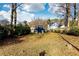 Large backyard with a view of a charming blue house at 1587 Alder Se Ct, Atlanta, GA 30317
