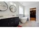 Bathroom with double vanity, soaking tub and walk-in closet at 1587 Alder Se Ct, Atlanta, GA 30317