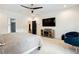 Main bedroom with TV, fireplace, and seating area at 1587 Alder Se Ct, Atlanta, GA 30317