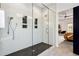 Large walk-in shower with herringbone floor and glass enclosure at 1587 Alder Se Ct, Atlanta, GA 30317