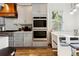 Modern kitchen with double oven and built-in bench seating at 1587 Alder Se Ct, Atlanta, GA 30317