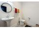Modern powder room with pedestal sink and toilet at 1587 Alder Se Ct, Atlanta, GA 30317
