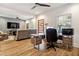 Home office with built-in desk and hardwood floors at 1587 Alder Se Ct, Atlanta, GA 30317