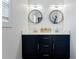 Double vanity bathroom with large mirrors and modern lighting at 1587 Alder Se Ct, Atlanta, GA 30317