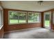 Bright sunroom with backyard views and sliding glass doors at 1799 Brandy Woods Se Trl, Conyers, GA 30013