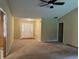 Light and airy entryway with neutral carpeting and ceiling fan at 1799 Brandy Woods Se Trl, Conyers, GA 30013