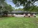 Ranch-style home with brick and siding exterior, and a well-maintained lawn at 1799 Brandy Woods Se Trl, Conyers, GA 30013