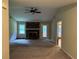 Spacious living room with a brick fireplace and access to a sunroom at 1799 Brandy Woods Se Trl, Conyers, GA 30013