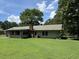 View of the back of the house and the yard at 1799 Brandy Woods Se Trl, Conyers, GA 30013