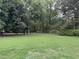 Large backyard with a chain link fence at 1799 Brandy Woods Se Trl, Conyers, GA 30013