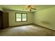Spacious bedroom with window, closet, and ceiling fan at 1799 Brandy Woods Se Trl, Conyers, GA 30013