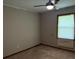 Simple bedroom with neutral walls, carpet, and a window with blinds at 1799 Brandy Woods Se Trl, Conyers, GA 30013