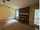 Living Room with brick fireplace and carpet flooring at 1799 Brandy Woods Se Trl, Conyers, GA 30013