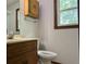 Bathroom with vanity, toilet, and shower/tub combo at 1799 Brandy Woods Se Trl, Conyers, GA 30013