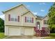 House exterior featuring a two-car garage and charming front porch at 376 Cattlemans Cir, Mcdonough, GA 30252