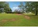 Large backyard with grassy area and home visible at 376 Cattlemans Cir, Mcdonough, GA 30252
