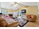 Spacious living room with a stone fireplace and hardwood floors at 376 Cattlemans Cir, Mcdonough, GA 30252