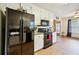 Modern kitchen with black stainless steel appliances and white cabinetry at 376 Cattlemans Cir, Mcdonough, GA 30252