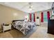 Large Primary bedroom with carpeted floors and a ceiling fan at 376 Cattlemans Cir, Mcdonough, GA 30252