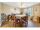 Bright dining room features a wood table with chairs and hardwood floors at 376 Cattlemans Cir, Mcdonough, GA 30252