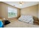 Bedroom with a sofa bed and window with blinds at 376 Cattlemans Cir, Mcdonough, GA 30252