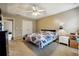 Spacious bedroom with carpet, ceiling fan, and double doors to closet at 376 Cattlemans Cir, Mcdonough, GA 30252