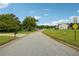 Quiet residential street with homes and green space at 376 Cattlemans Cir, Mcdonough, GA 30252