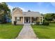 Charming yellow house with a spacious front porch at 6860 Main St, Lithonia, GA 30058